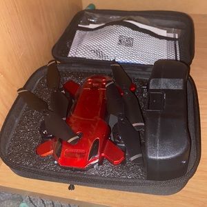 Red candy apple drone with a remote control